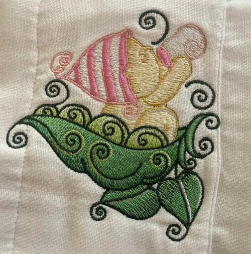 baby girl with bottle embroidery